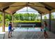 This fun game room features a ping pong table and seating for people to enjoy themselves and be social at 207 Somerset Acres Dr, Summerville, SC 29486