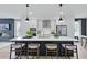 Modern kitchen with white cabinetry, a large island with seating, and stainless steel appliances at 207 Somerset Acres Dr, Summerville, SC 29486