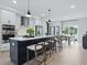 Gourmet kitchen featuring stainless steel appliances, quartz countertops, and an island with bar seating at 207 Somerset Acres Dr, Summerville, SC 29486