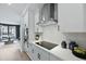 Modern kitchen with stainless steel appliances, white countertops, and sleek cooktop at 207 Somerset Acres Dr, Summerville, SC 29486