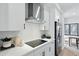 White kitchen featuring stainless steel appliances, subway tile backsplash, and modern countertops at 207 Somerset Acres Dr, Summerville, SC 29486