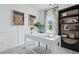 Stylish home office with a white desk, decorative art, built-in bookshelves, and large window at 207 Somerset Acres Dr, Summerville, SC 29486