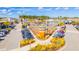 Aerial view of a vibrant shopping center with plenty of parking, restaurants, and retail stores at 207 Somerset Acres Dr, Summerville, SC 29486