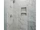 Elegant shower with marble-like tile, chrome fixtures, and built-in storage niches at 207 Somerset Acres Dr, Summerville, SC 29486