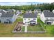 An aerial shows the backyard with garden, porch and a wooden privacy fence at 211 Squire Pope Rd, Summerville, SC 29486