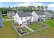 Aerial view of a fenced backyard with a garden, swing set, and screened porch at 211 Squire Pope Rd, Summerville, SC 29486