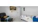 Bright bedroom with a comfortable chair, decorative paddle, painting, and a serene view at 211 Squire Pope Rd, Summerville, SC 29486