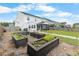 A backyard featuring raised garden beds, perfect for gardening and outdoor enjoyment at 211 Squire Pope Rd, Summerville, SC 29486