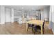 Open-concept kitchen with island, stainless steel appliances, and adjacent dining area for easy entertaining and Gathering meals at 211 Squire Pope Rd, Summerville, SC 29486