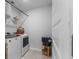 Functional laundry area with modern machines and extra storage for laundry supplies at 211 Squire Pope Rd, Summerville, SC 29486