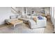 Comfortable living room with a large sectional sofa and a view into the kitchen, creating an open-concept space at 211 Squire Pope Rd, Summerville, SC 29486