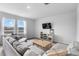 Relaxing living room with a large sectional sofa, neutral decor, and a view of the neighborhood pond at 211 Squire Pope Rd, Summerville, SC 29486