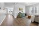 Spacious living room with hardwood floors, modern decor, and plenty of natural light from the windows at 211 Squire Pope Rd, Summerville, SC 29486
