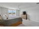 A serene main bedroom offers scenic views, a light dresser, and soft, neutral decor at 211 Squire Pope Rd, Summerville, SC 29486