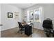 Bright home office with large window, desk, and exercise equipment for a productive and healthy lifestyle at 211 Squire Pope Rd, Summerville, SC 29486