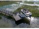Aerial view featuring a private boat dock and lift with picturesque waterfront views at 2128 Breezy Point Dr, Mount Pleasant, SC 29466