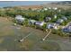 Stunning aerial view of waterfront homes with private docks and lush green surroundings at 2128 Breezy Point Dr, Mount Pleasant, SC 29466