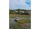 Aerial view showcasing multiple homes, waterways, and boat docks with boat lifts on property at 2128 Breezy Point Dr, Mount Pleasant, SC 29466
