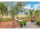 Beautiful backyard with a wooden walkway, lush landscaping, and scenic views at 2128 Breezy Point Dr, Mount Pleasant, SC 29466