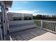 Enjoy serene views from this balcony with built-in seating and lush landscaping at 2128 Breezy Point Dr, Mount Pleasant, SC 29466