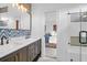 Elegant bathroom with a double vanity, decorative mirror, and shower, offering a serene and stylish space at 2128 Breezy Point Dr, Mount Pleasant, SC 29466