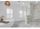 Luxurious bathroom with a free-standing tub and glass-enclosed shower at 2128 Breezy Point Dr, Mount Pleasant, SC 29466