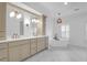 Elegant bathroom with double sinks, a soaking tub, and marble tile floors at 2128 Breezy Point Dr, Mount Pleasant, SC 29466