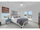 Inviting bedroom featuring a comfortable bed, decorative bedside tables, and access to a balcony with scenic views, perfect for relaxation at 2128 Breezy Point Dr, Mount Pleasant, SC 29466