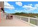 Expansive deck with outdoor dining area, offering breathtaking views of the marsh landscape and serene waterway at 2128 Breezy Point Dr, Mount Pleasant, SC 29466