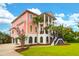 Beautiful two-story home featuring a grand entrance with stairs and columns, complemented by well-maintained landscaping at 2128 Breezy Point Dr, Mount Pleasant, SC 29466