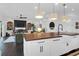 Bright, modern kitchen with pendant lights, a large island, and seamlessly transitions to the living area at 2128 Breezy Point Dr, Mount Pleasant, SC 29466