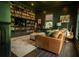 Inviting library featuring a wall of bookshelves, comfortable seating, and a desk, ideal for a home office at 2128 Breezy Point Dr, Mount Pleasant, SC 29466