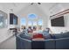 Open concept living room with vaulted ceiling and sliding glass doors to the outdoor deck at 2128 Breezy Point Dr, Mount Pleasant, SC 29466
