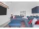 Comfortable living room with a large blue sectional sofa, TV, and stylish decor, ideal for relaxation and entertainment at 2128 Breezy Point Dr, Mount Pleasant, SC 29466