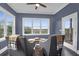 Cozy sitting room with comfortable chairs, a ceiling fan, and a view of the outdoors at 2128 Breezy Point Dr, Mount Pleasant, SC 29466