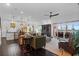 Open-concept living space features dark hardwood floors, comfortable seating, and a serene view of the outdoors at 2128 Breezy Point Dr, Mount Pleasant, SC 29466