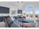 Spacious living room with vaulted ceilings, built-in cabinets, and access to a private balcony at 2128 Breezy Point Dr, Mount Pleasant, SC 29466