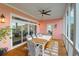 Relax on the screened porch featuring a dining area, ideal for enjoying meals outdoors at 2128 Breezy Point Dr, Mount Pleasant, SC 29466