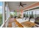 Spacious screened porch featuring dining area and marsh views at 2128 Breezy Point Dr, Mount Pleasant, SC 29466