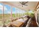 Enjoy the marsh views from the large screened porch, with dining area and ceiling fans at 2128 Breezy Point Dr, Mount Pleasant, SC 29466