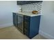 Charming wet bar with quartz countertop and custom cabinets with a wine fridge at 2128 Breezy Point Dr, Mount Pleasant, SC 29466