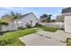Spacious backyard featuring a concrete patio, lush lawn, and a white picket fence, perfect for outdoor enjoyment at 221 Trillium Ave, Summerville, SC 29483