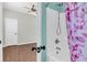 Modern bathroom with combination shower and tub, and view into adjacent bedroom at 221 Trillium Ave, Summerville, SC 29483