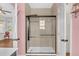 Bathroom featuring a glass shower with a rainfall shower head, and tiled walls at 221 Trillium Ave, Summerville, SC 29483