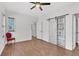 Bright bedroom with wood floors, ceiling fan, closet, and a view into other rooms at 221 Trillium Ave, Summerville, SC 29483