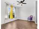 Bedroom featuring a large window with natural light, wood floors and stylish furnishings at 221 Trillium Ave, Summerville, SC 29483