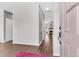 Bright entryway with a pink door, modern flooring, and a glimpse into the living spaces, creating a welcoming ambiance at 221 Trillium Ave, Summerville, SC 29483
