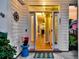 Inviting front porch with decor offering a glimpse into the home's interior and a cozy fireplace at 221 Trillium Ave, Summerville, SC 29483