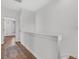 Hallway with white walls, wood floors, and a view into the connecting room at 221 Trillium Ave, Summerville, SC 29483