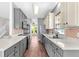 Spacious kitchen with modern appliances, ample counter space, and stylish cabinetry, perfect for culinary creations and gatherings at 221 Trillium Ave, Summerville, SC 29483